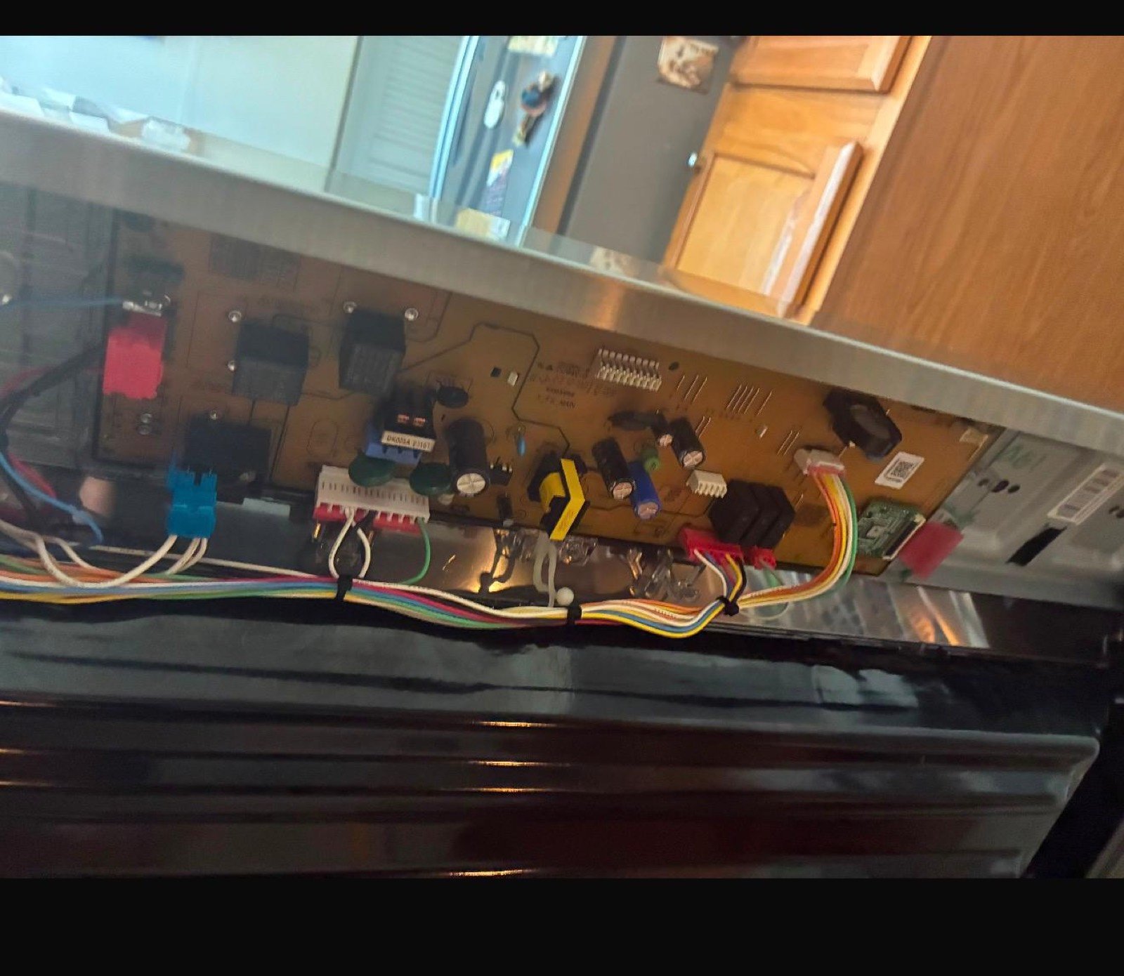 Control electronics behind an oven panel